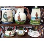 A selection of Torquay ware teapots & puzzle jug etc.