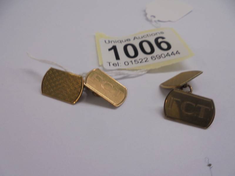 A pair of 9ct gold monogrammed cuff links, 5.84 grams.