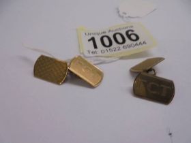 A pair of 9ct gold monogrammed cuff links, 5.84 grams.