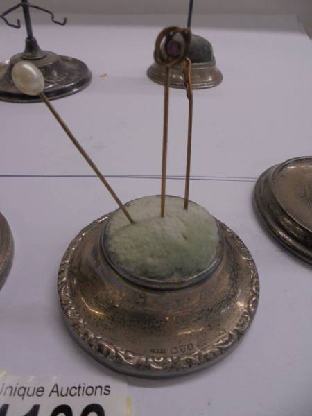 Four silver hat pin stands and two others. - Image 5 of 7