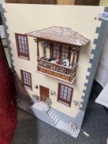 A mediteranean style dolls house frontage for use as a wall hanging
