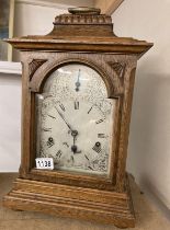 An oak cased mantel clock with silvered dial, COLLECT ONLY.