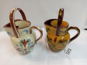 A pair of watering can shaving mug jugs. Height 20cm