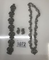 A cut steel necklace and matching bracelet and earrings