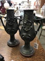 A pair of bronze vases with applied dragons, 17 cm tall