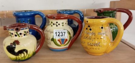 6 Puzzle jugs including Torquay ware