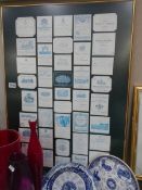 A quantity of framed and glazed wine labels