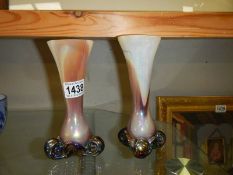 A pair of coloured glass vases.
