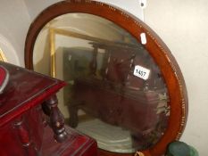 An oval framed bevel edged mirror, COLLECT ONLY.
