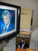 A quantity of music and acting related books and a picture of Rod Stewart.