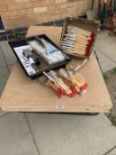 A paste table, paintbrushes & rollers