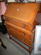 A mid 20th century oak bureau, COLLECT ONLY.