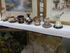 A mixed lot of Torquay motto ware including hat pin stands.