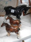 Three ceramic horses.