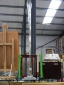 A tall clear glass specimen vase and a pair of green glass specimen vases, COLLECT ONLY.