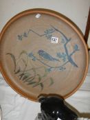 A hand-thrown Cumbrian art pottery charger (Floral and bird decoration).