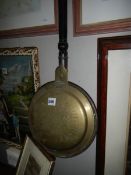 A Victorian brass and copper warming pan, COLLECT ONLY.