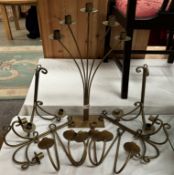 A quantity of wrought iron wall candle holders, mainly pairs