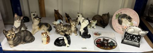 A quantity of cats including a calendar, plate & window art