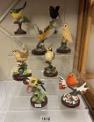 A collection of 8 atlas bird figures