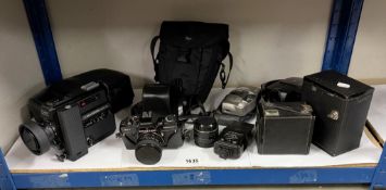 A quantity of old camera's etc.
