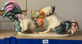 A large ceramic cock fighting figure group, Length 58cm