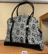 A lovely new black & grey ladies holdall with patent handles & base
