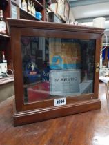 Early 20th C. mahogany display cabinet with four tobacco tins. {33 cm H x 36 cm W x 15 cm D}.