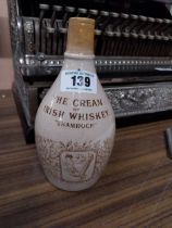Shamrock Cream Irish Whiskey stoneware flagon. {32cm H x 11 cm Dia.}.