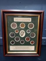 Decimal coin set mounted in mahogany frame {H 31cm x w 26cm}.