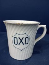 Ceramic OXO advertising cup {H 8cm x W 10cm x D 8cm }.