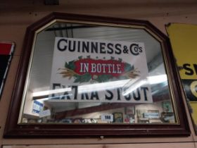 Guinness Extra Stout In Bottle framed advertising mirror. {55 cm H x 68 cm W}.