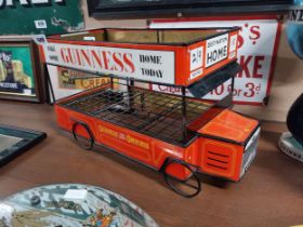 Guinness advertising tinplate milk crate in the form of a Bus. {27 cm H x 47 cm W x 23 cm D}.