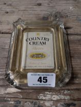 Country Cream glass advertising ashtray. {13 cm H x 16 cm W}.