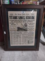 The Boston Daily Globe with headlines Titanic Sinks 1500 Die framed advertising print.