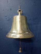 Wall mounted bronze bell with floral design {H 25cm x W 19cm x D 20cm }.