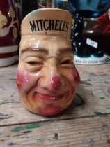 Mitchells Old Irish Whiskey Belfast ceramic advertising water jug. {15 cm H x 11 cm W x 15 cm D}.