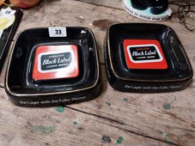 Two Carling Black Label ceramic advertising ashtrays by Royal Norfolk. {5 cm H x 21 cm W}.