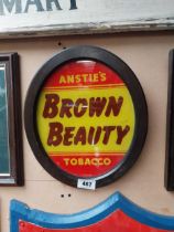 Anstie's Brown Beauty Tobacco reverse painted glass advertising sign {36 cm H x 31 cm W}.