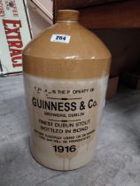 Guinness and Co four gallon stoneware whiskey flagon. {47 cm H x 26 cm Dia.}.