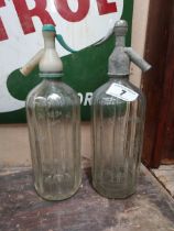 Two soda siphons - Mineral Waters Distillers Dublin. {32 cm H x 9 cm Dia.}.