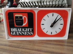 Draught Guinness Perspex battery advertising clock. {18 cm H x 27 cm W x 8 cm D}.