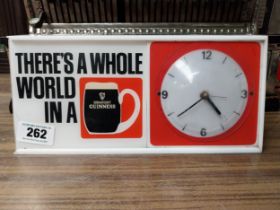 There's a whole world in Guinness Perspex battery advertising clock. {15 cm H x 32 cm W x 8 cm D}.