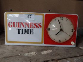 Guinness Time Perspex advertising clock. {14 cm H x 38 cm W}.