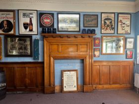 Collection of early 20th C. oak panelling and fireplace. Approx 80ft x 114 cm of panelling and