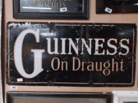 Guinness on Draught enamel advertising sign. {45 cm H x 91 cm W}.