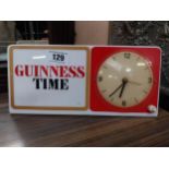 Guinness Time Perspex battery operated advertising clock. {15 cm H x 30 cm W}.