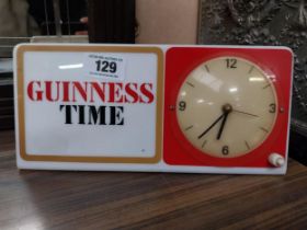 Guinness Time Perspex battery operated advertising clock. {15 cm H x 30 cm W}.