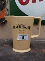 Mackinlays Scotch Whiskey ceramic advertising water jug. {16 cm H x 16 cm W x 6 cm D}.