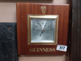 Guinness mahogany Barometer. {23 cm H x 23 cm W}.